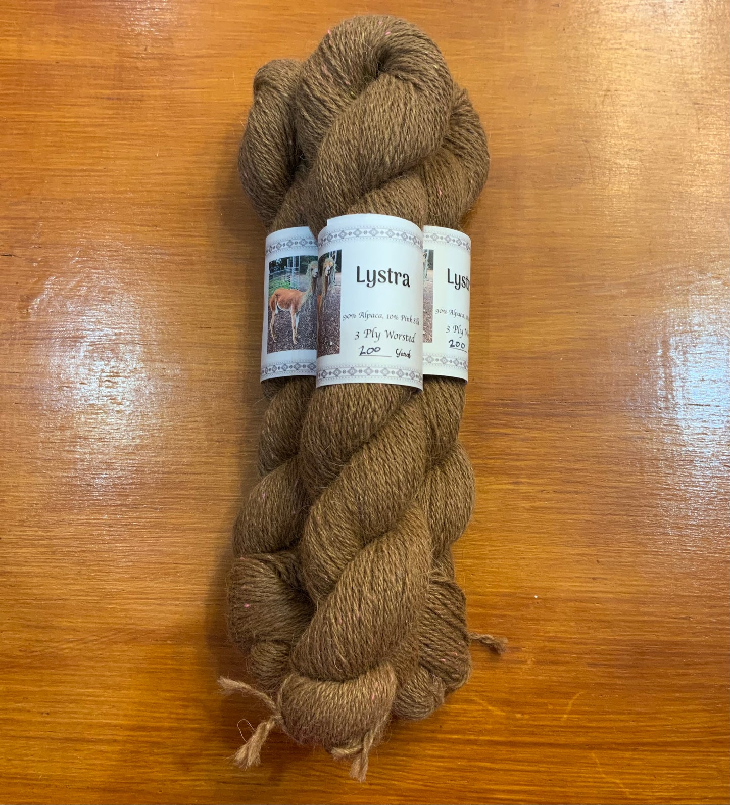 Lystra 3ply worsted. 10% pink silk