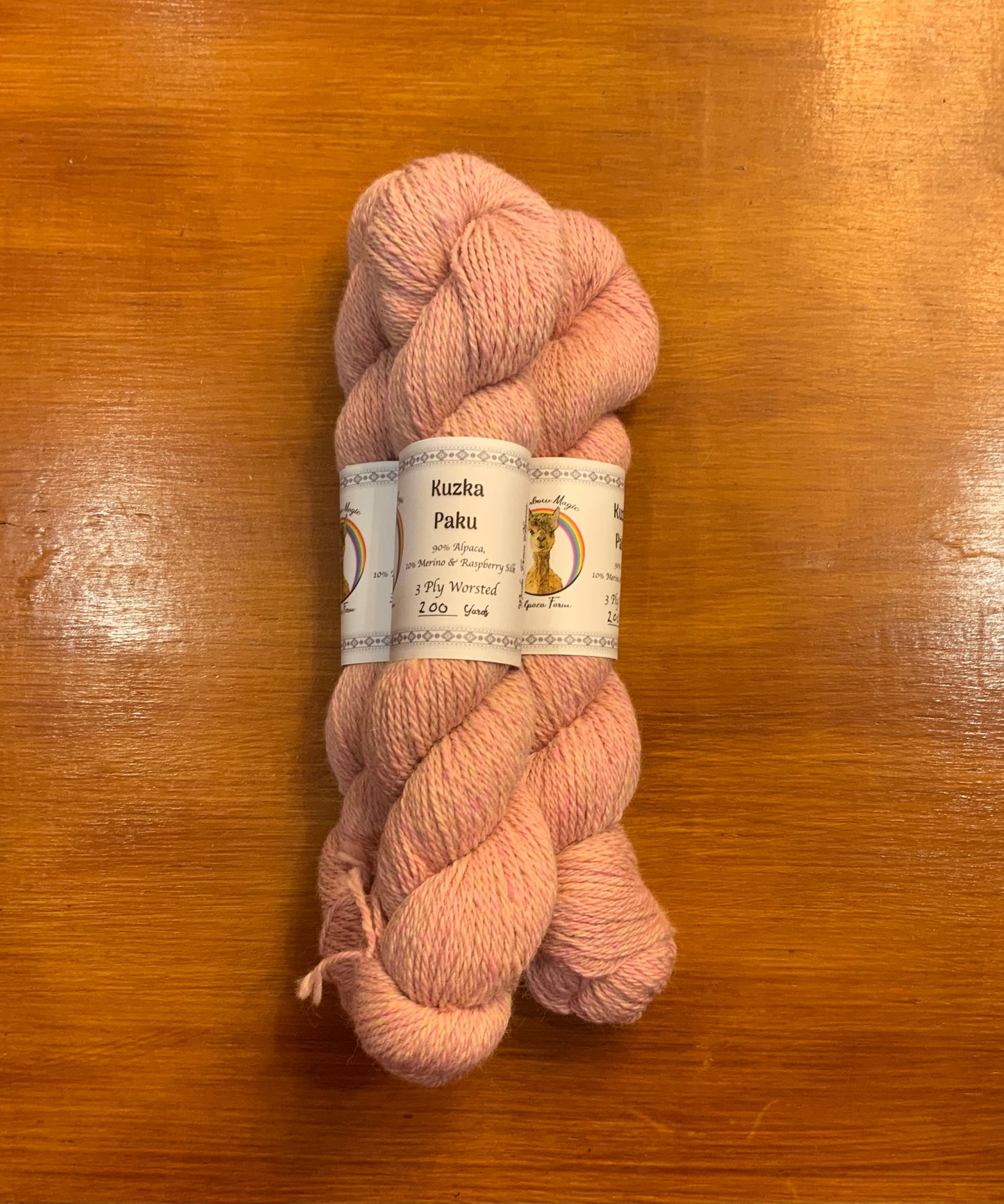 Kuzka 3ply worsted 10% merino/silk blend raspberry lemonaid